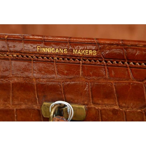 782 - A crocodile hide dressing case, early 20th c, marked on gilt brass locks Finnegans Ltd London, key, ... 