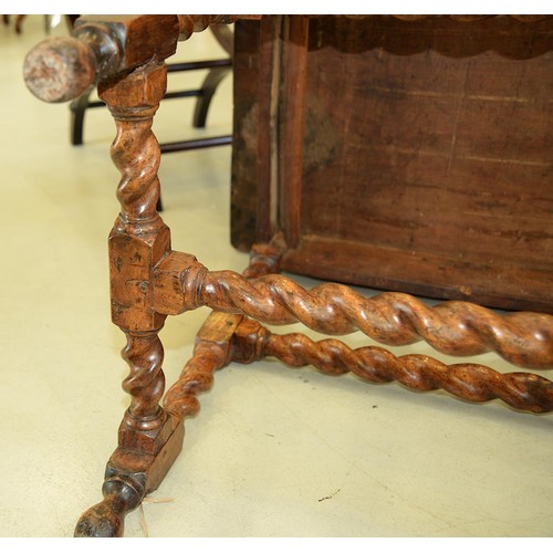 1107 - A William III walnut side table, the oversailing rectangular top with ovolo lip, the drawer and side... 