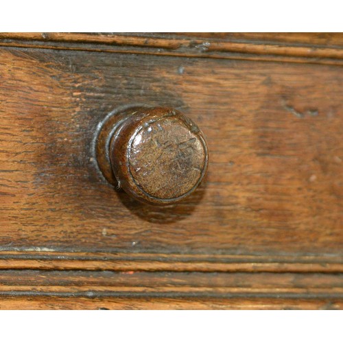 1122 - A William III oak chest of four geometrically moulded drawers, possibly East Anglian, late 17th c, o... 