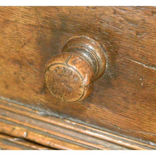 1122 - A William III oak chest of four geometrically moulded drawers, possibly East Anglian, late 17th c, o... 