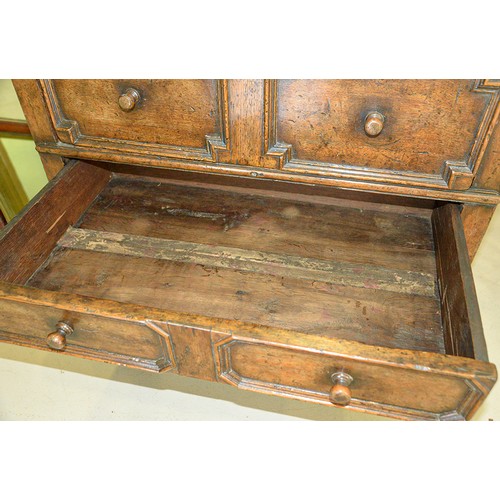 1122 - A William III oak chest of four geometrically moulded drawers, possibly East Anglian, late 17th c, o... 