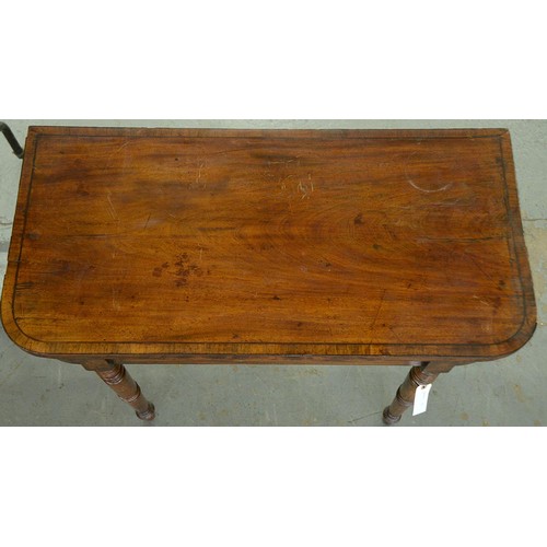 1260 - A Victorian mahogany card table, crossbanded in rosewood and line inlaid, on ring turned legs, 76cm ... 