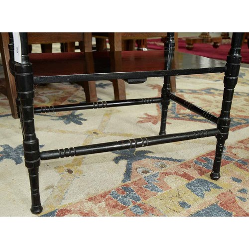 559 - A Victorian 'Anglo-Japanese' ebonised two tier occasional table, the design in the manner of E W God... 