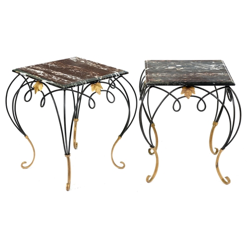 562 - A pair of black and gilt painted steel tables with black and white marble top, late 20th c, 57cm h; ... 