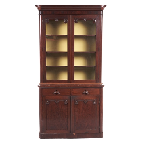 569 - A Victorian mahogany bookcase, the upper part fitted with adjustable shelves enclosed by glazed door... 