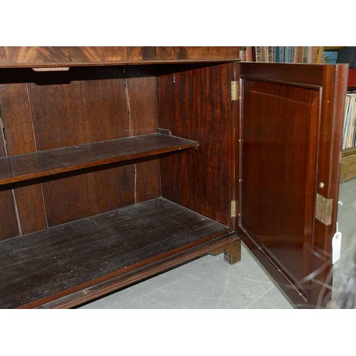 570 - A mahogany bookcase, early 19th c, with stepped cornice and figured frieze, fitted with adjustable s... 