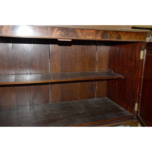 570 - A mahogany bookcase, early 19th c, with stepped cornice and figured frieze, fitted with adjustable s... 