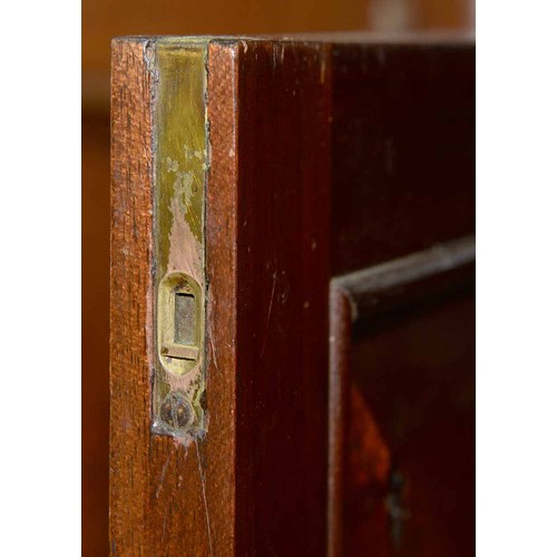 570 - A mahogany bookcase, early 19th c, with stepped cornice and figured frieze, fitted with adjustable s... 