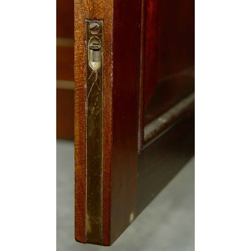 570 - A mahogany bookcase, early 19th c, with stepped cornice and figured frieze, fitted with adjustable s... 