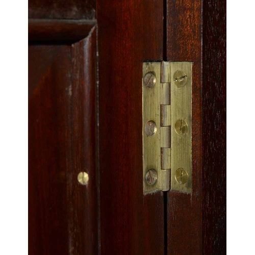 570 - A mahogany bookcase, early 19th c, with stepped cornice and figured frieze, fitted with adjustable s... 