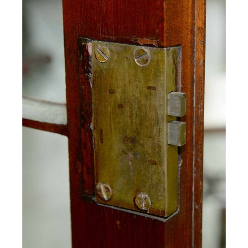 570 - A mahogany bookcase, early 19th c, with stepped cornice and figured frieze, fitted with adjustable s... 