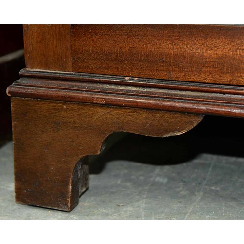 570 - A mahogany bookcase, early 19th c, with stepped cornice and figured frieze, fitted with adjustable s... 