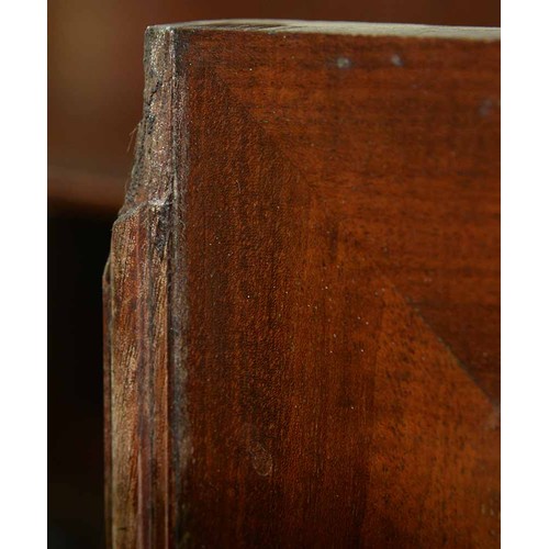 570 - A mahogany bookcase, early 19th c, with stepped cornice and figured frieze, fitted with adjustable s... 