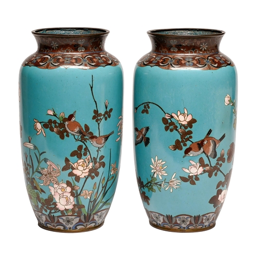 104 - A pair of Japanese cloisonne enamel vases, Meiji period, of shouldered form decorated with birds and... 