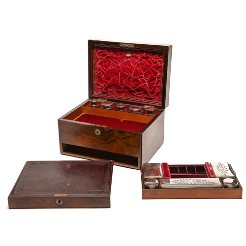 185 - A Victorian rosewood dressing case, with maroon morocco lined and fitted interior and glass jars and... 