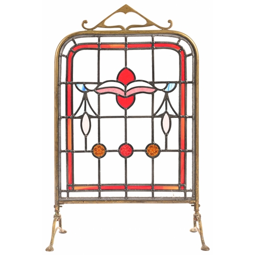 192 - An Edwardian brass framed leaded glass firescreen, 61cm h and a set of three early 20th c leaded gla... 