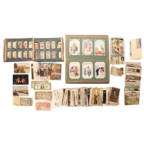 202 - An Edwardian album of postcards, first half 20th c, mostly comic, including Donald McGill, postally ... 