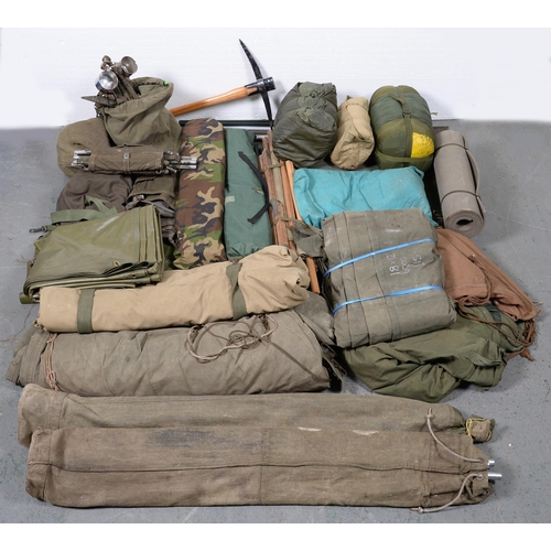 233 - Militaria. Miscellaneous tents, sleeping bags,  rolls, bed, etc, used by the late vendor when attend... 