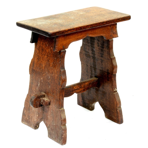 523 - An oak trestle stool, 19th / early 20th c, in Henry VIII style, with pegged stretcher, 56cm h; 27 x ... 