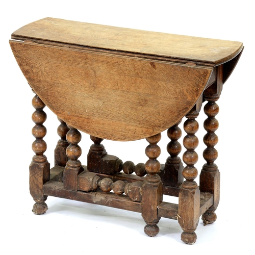 528 - A miniature oak gateleg table, 19th / early 20th c, in Charles II style, the oval top on bobbin turn... 