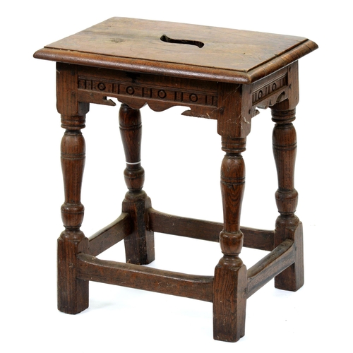 540 - An oak joined stool, early 20th c, in Charles II style, the pierced seat above channelled sides, on ... 