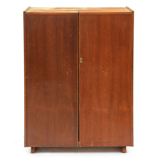 542 - A mid-century modern Newcraft teak 'Home Office', of triptych form with fitted interior and sliding ... 