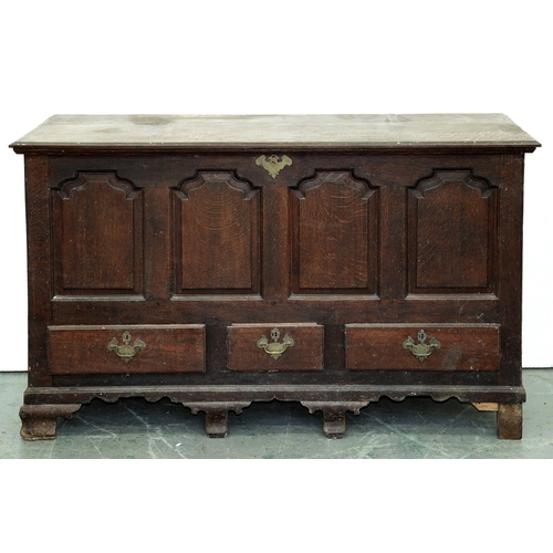 553 - A George III oak mule chest, with substantial, moulded lid, the front having four ogee raised and fi... 