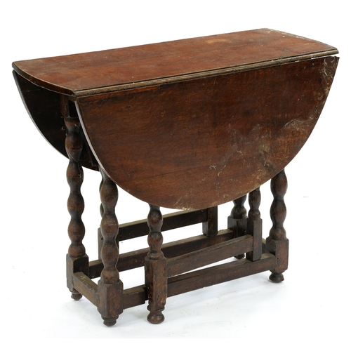 556 - An oak gateleg table, part 18th c, on bobbin underframe, 70cm h; 88 x 106cm