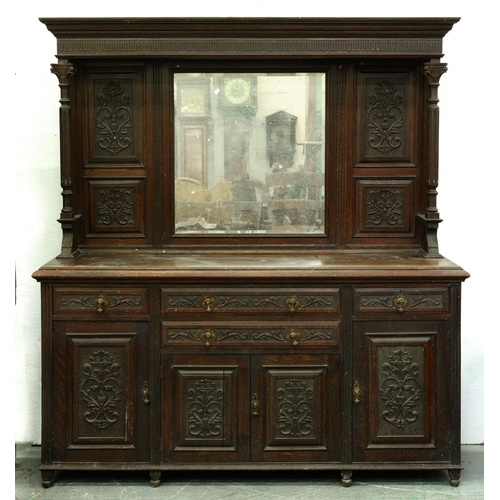 558 - A Victorian oak mirror-back sideboard, c1900, with carved panels and fluted pillars, the lower part ... 