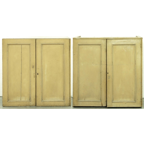 595 - A Victorian painted pine cupboard, fitted with shelves enclosed by panelled doors, the beige / buff ... 