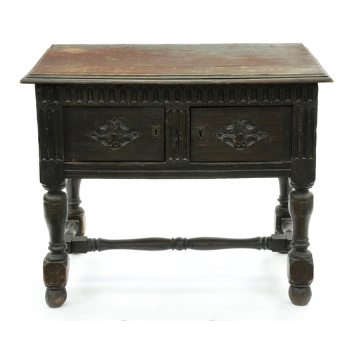 599 - An oak side table, late 19th c, incorporating earlier elements, the nulled frieze above two lozenge ... 