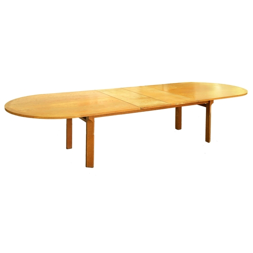 609 - An oak table, c1970, with semi-circular ends and two leaves, on chamfered legs, 73cm h; 120 x 360cm... 