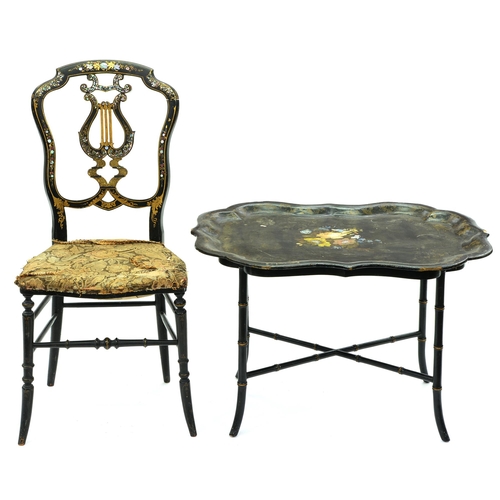 614 - A Victorian painted papier mache tea tray, adapted as a table on ebonised faux bamboo legs, 49cm h; ... 