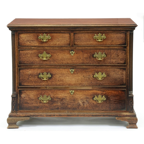 627 - A George III oak chest of drawers, moulded top above two short and three graduated drawers flanked b... 