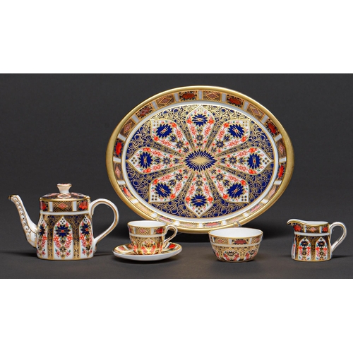 63 - A Royal Crown Derby miniature Imari pattern tea service, early 21st c, tray 19.5cm l, printed mark, ... 