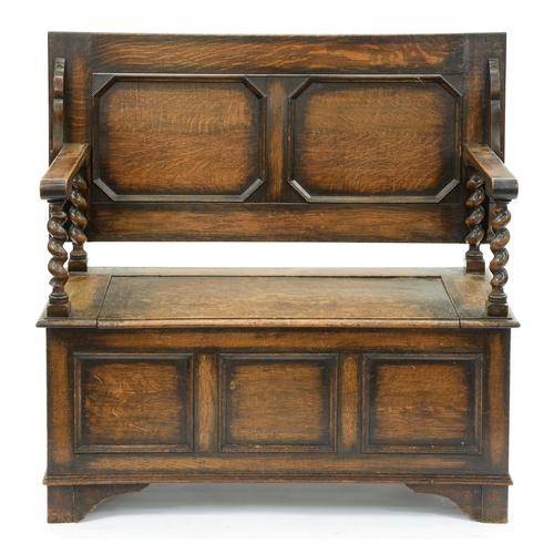 641 - An oak monks bench, c1930, with panelled front, 78cm h (top down); 50 x 106cm