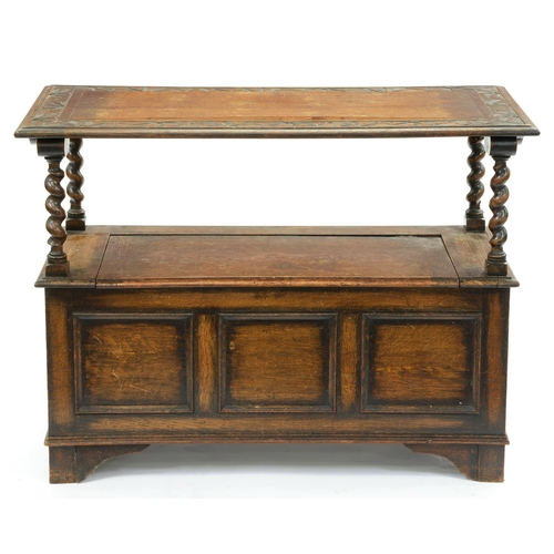 641 - An oak monks bench, c1930, with panelled front, 78cm h (top down); 50 x 106cm