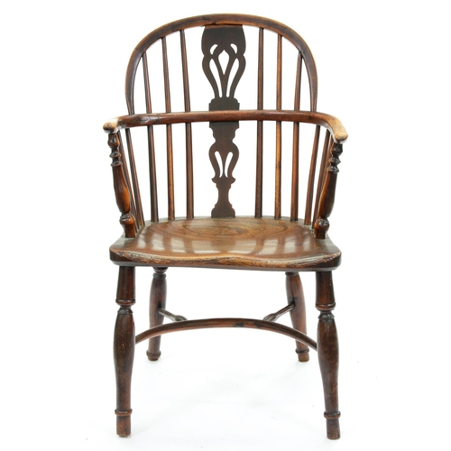 660 - A Victoria yew wood low back Windsor chair, East Midlands Region, with crinoline stretcher, elm seat... 