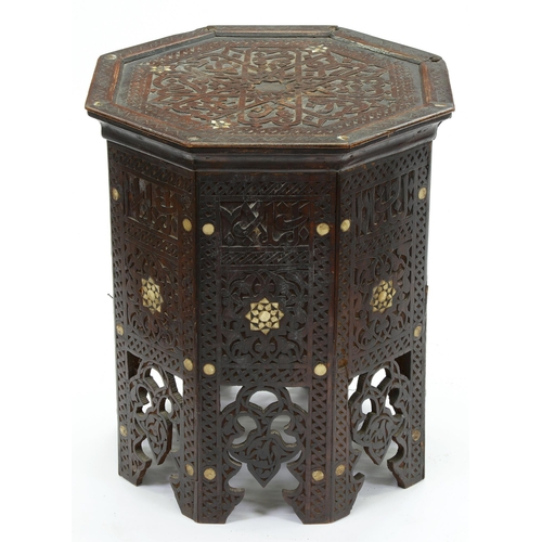 662 - A Indian carved and mother of pearl inlaid octagonal table, late 19th c, 50cm h; 43 x 43cm... 