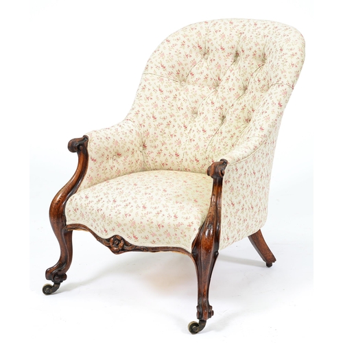 664 - A Victorian walnut armchair, in buttoned upholstery and brass castors, seat height 36cm... 