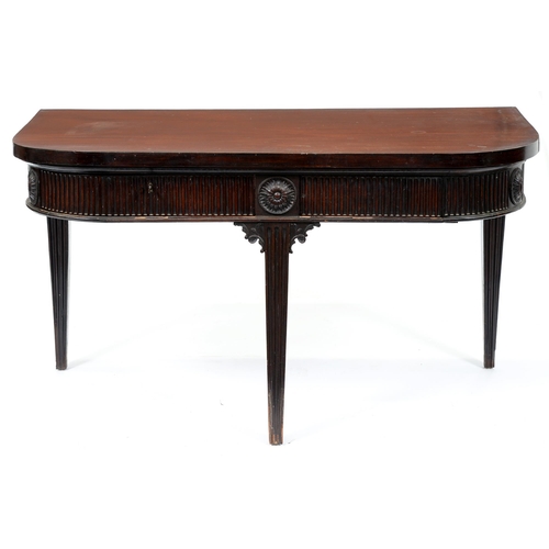 666 - A mahogany side table, early 20th c, in George III neo classical style, the fluted frieze with round... 