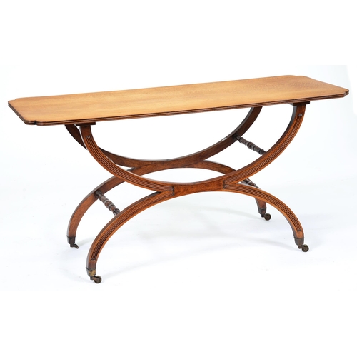 667 - A Victorian oak table, the oblong top with indented corners, on X-frame with turned stretchers and b... 