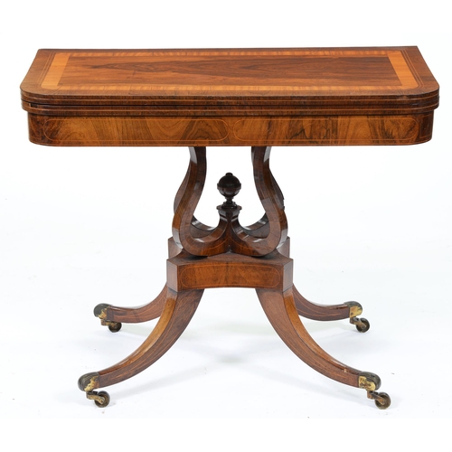 672 - An early Victorian rosewood card table, crossbanded in satinwood and line inlaid, on quadruple scrol... 