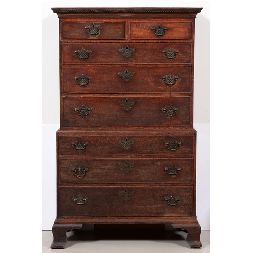 680 - A George III oak chest-on-chest, the dentil cornice above two short and three graduated cockbeaded d... 