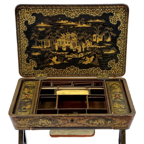 687 - A Chinese black and gold lacquer work table for the English market, 19th c, the fitted interior with... 