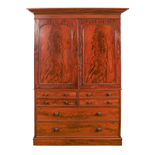 699 - A fine Victorian mahogany linen press, in the manner of T Willson of Queen Street, London, the upper... 