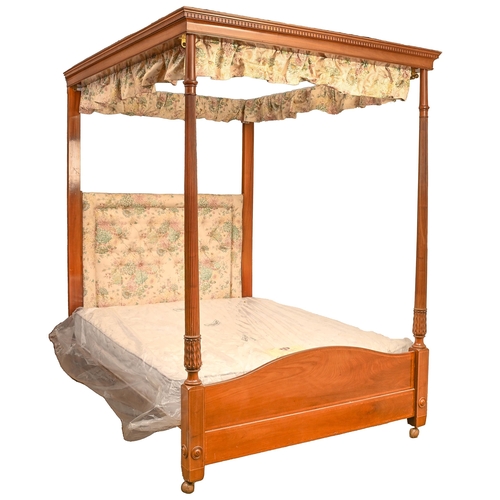 701 - A mahogany and line inlaid four-poster bed, early 20th c, with dentil tester and reeded, leaf carved... 