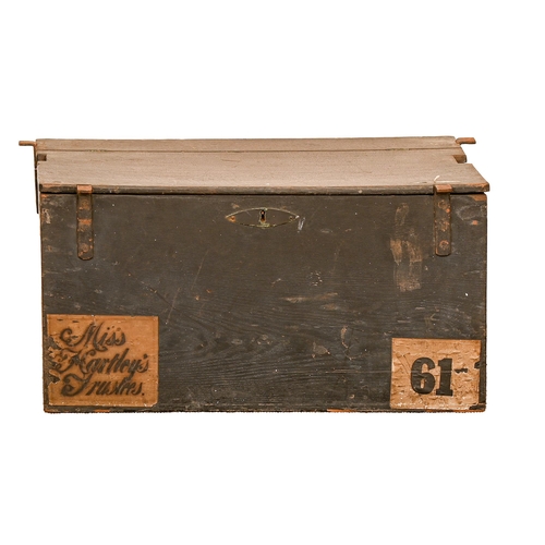 703 - An English oak travelling coach trunk, early 19th c, with iron brackets and lock, black painted, pri... 