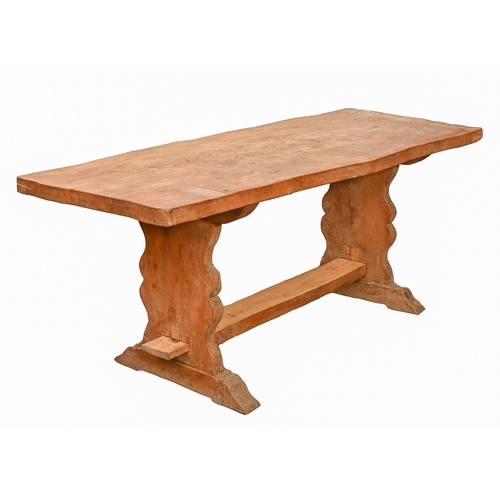 706 - An oak table, 20th c, the single plank top on profile trestle ends united by flat stretcher, 72cm h;... 