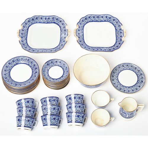 77 - A Mintons blue printed bone china tea service, early 20th c, the cups of bucket shape, pair of plate... 